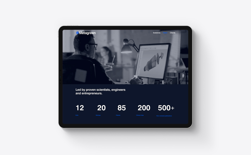 Metagreen website on ipad showing man using a desktop computer